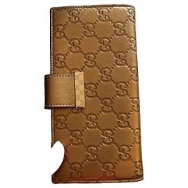 Gucci long wallet in embossed GG gold leather Golden