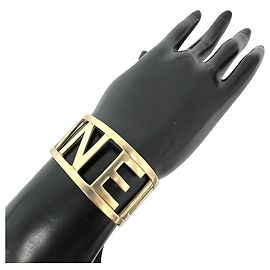 Chanel Gold Plated Logo Bangle Golden