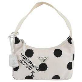 Borsa a tracolla Prada in nylon con logo a triangolo e pelle a pois Nero Bianco