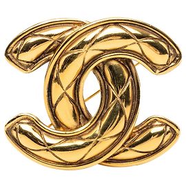 Broche épinglette matelassée Chanel CC plaquée or doré Doré