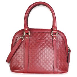 Bolso bandolera mini dome Gucci de piel Microguccissima rojo Roja