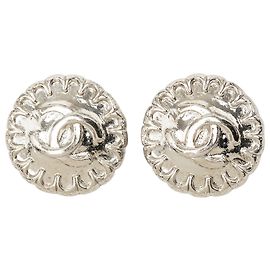 Boucles d'oreilles clips rondes en laiton CC argenté Chanel Argenté