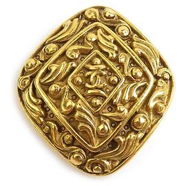 Spilla Chanel in metallo dorato D'oro