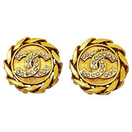 Boucles d'oreilles clips Chanel dorées avec strass Doré