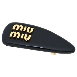 Fermi capelli in pelle vernita Miu Miu Nero
