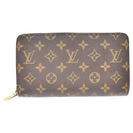 Cartera Zippy NM Monogram Canvas Louis Vuitton Castaño