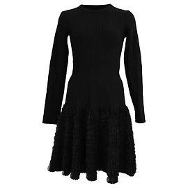Alaïa Rippstrick-Minikleid mit langen Ärmeln aus schwarzer Wolle Schwarz