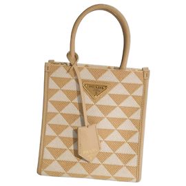 Prada Symbole Mini Mala Tote em tecido bordado e couro Saffiano Branco Bege