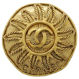 Broche Chanel avec logo Coco Doré