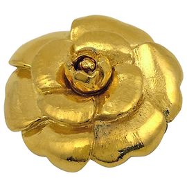 Broche Chanel Camélia en baño de oro Dorado