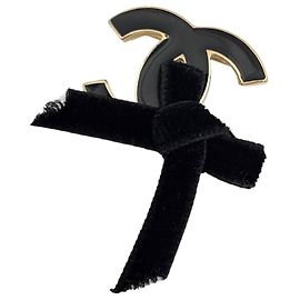 Spilla Chanel placcata oro nero Nero