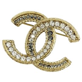Spilla Chanel placcata oro con strass D'oro