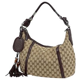 Bolsa de ombro Gucci marrom em GG Canvas Marrom