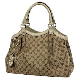 Bolsa Gucci Sukey bege em canvas GG e couro Bege