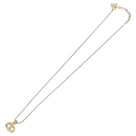 Pendentif Christian Dior CD en métal Doré