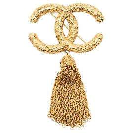 Broche Chanel Gold CC plaquée or à pompon de lave Doré