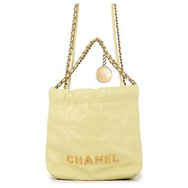 Chanel 22 Mini Coco Mark Shiny Calf Leather Handbag Yellow