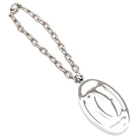 Portachiavi e charm logo Cartier in argento e ottone Argento