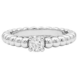 Bague solitaire Van Cleef & Arpels, "Perlée", or blanc et diamant.  Autre