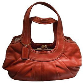 Coach orange leather kisslock handbag Coral