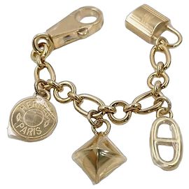 Hermès Porte-clé Olga en métal doré Doré