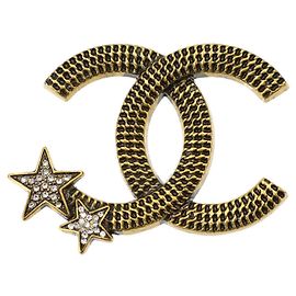 Spilla Chanel Coco Mark Star con strass D'oro