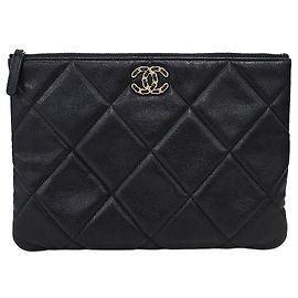 Chanel New Medium Clutch aus Lammleder Braun