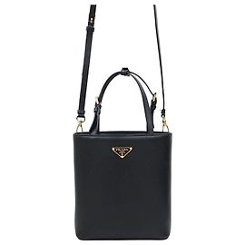 Prada Saco de ombro tote em couro com logótipo triangular escovado Marrom