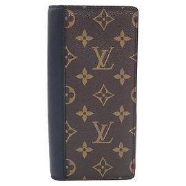 Louis Vuitton Cartera larga de latón Castaño