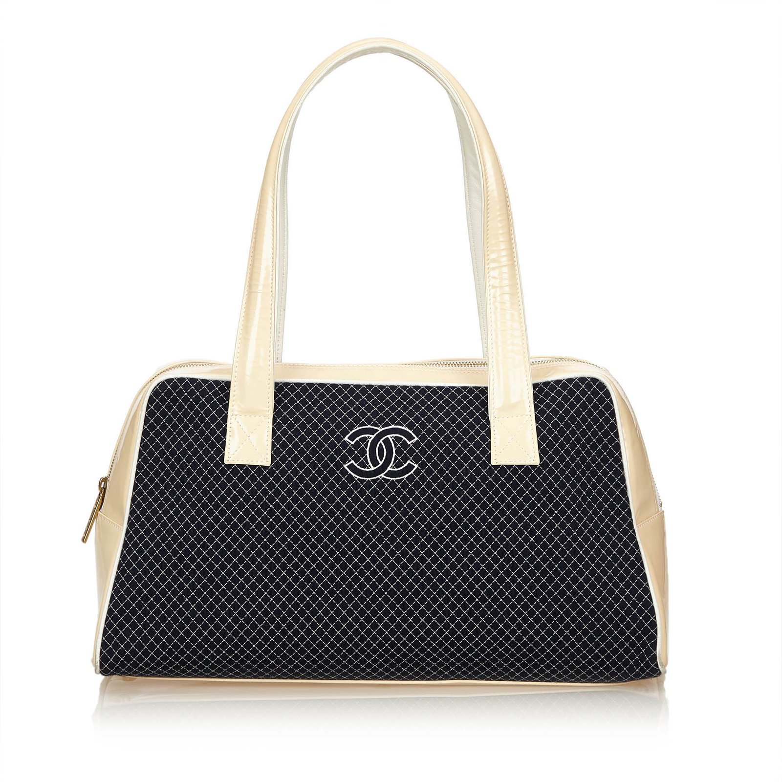 navy and cream handbags