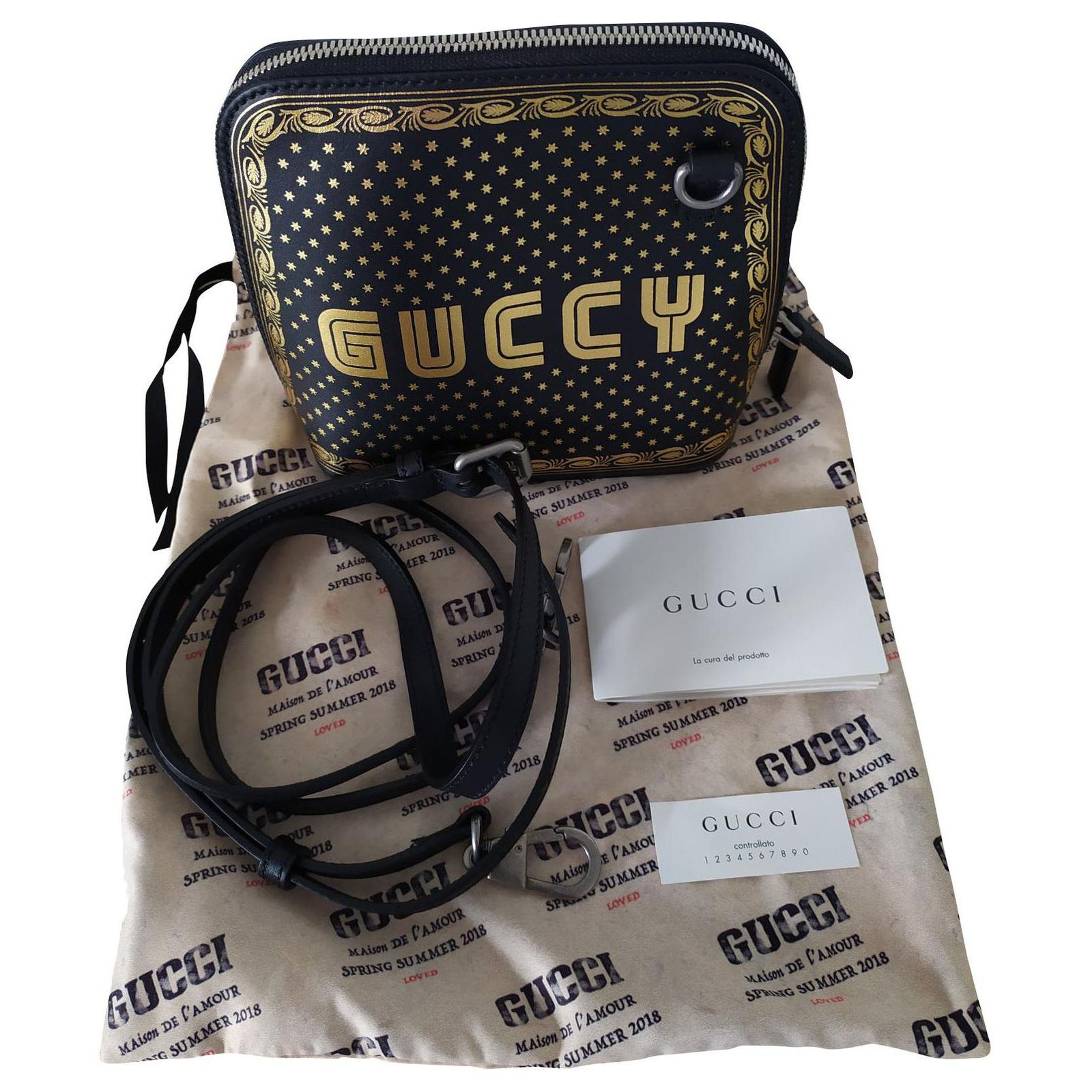 black and gold gucci purse