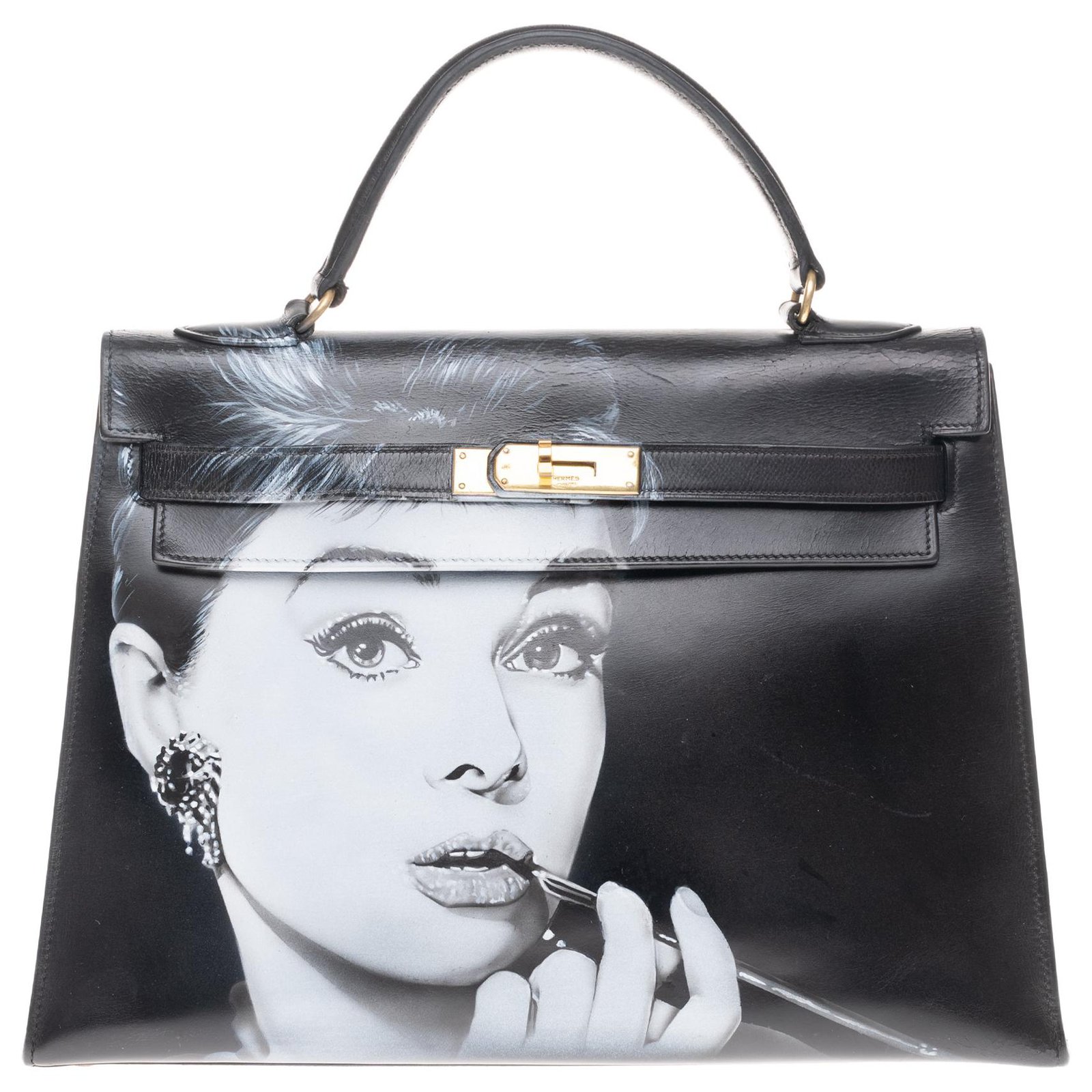 Audrey Hepburn Memorabilia. A black box leather Escale bag by