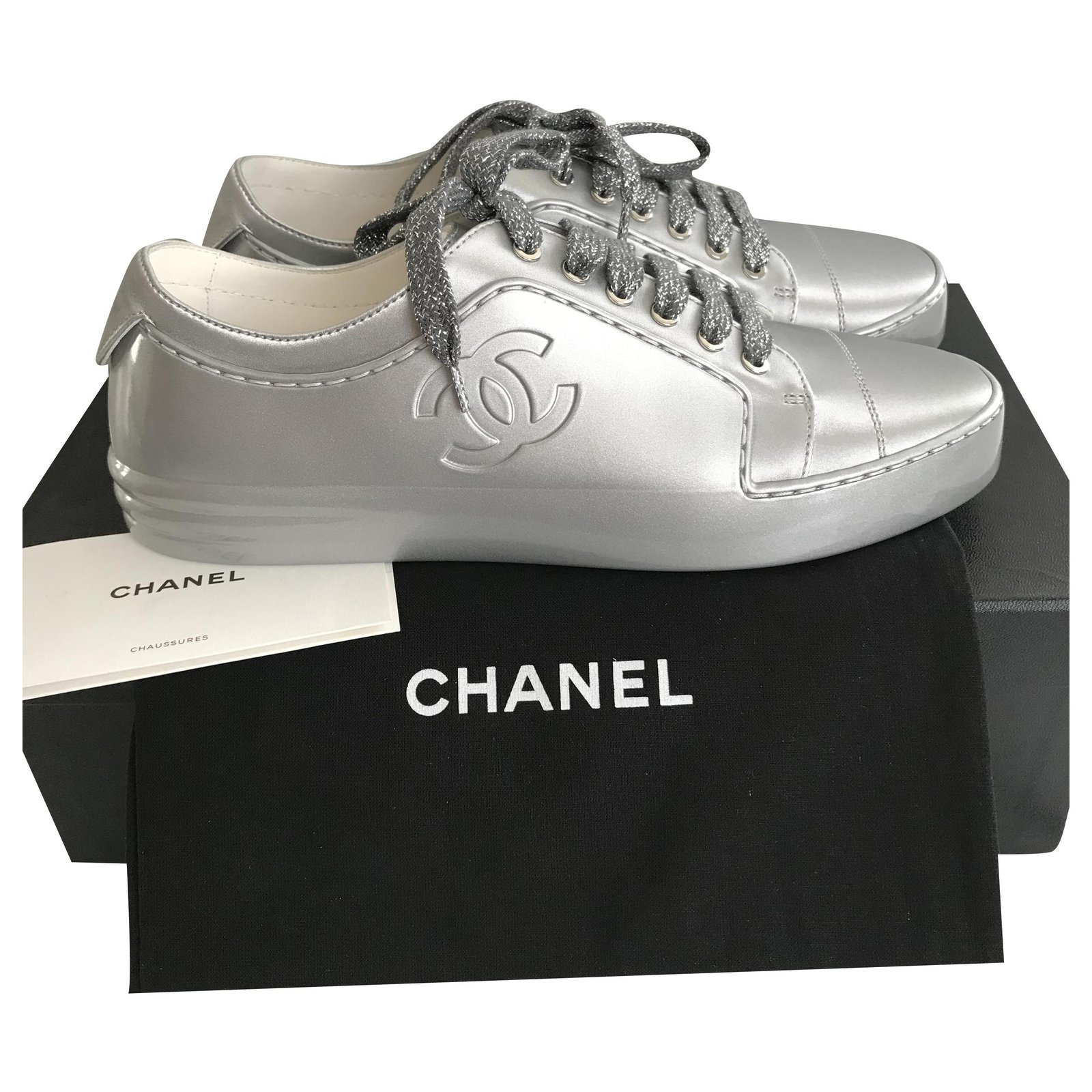 silver and white chanel sneakers