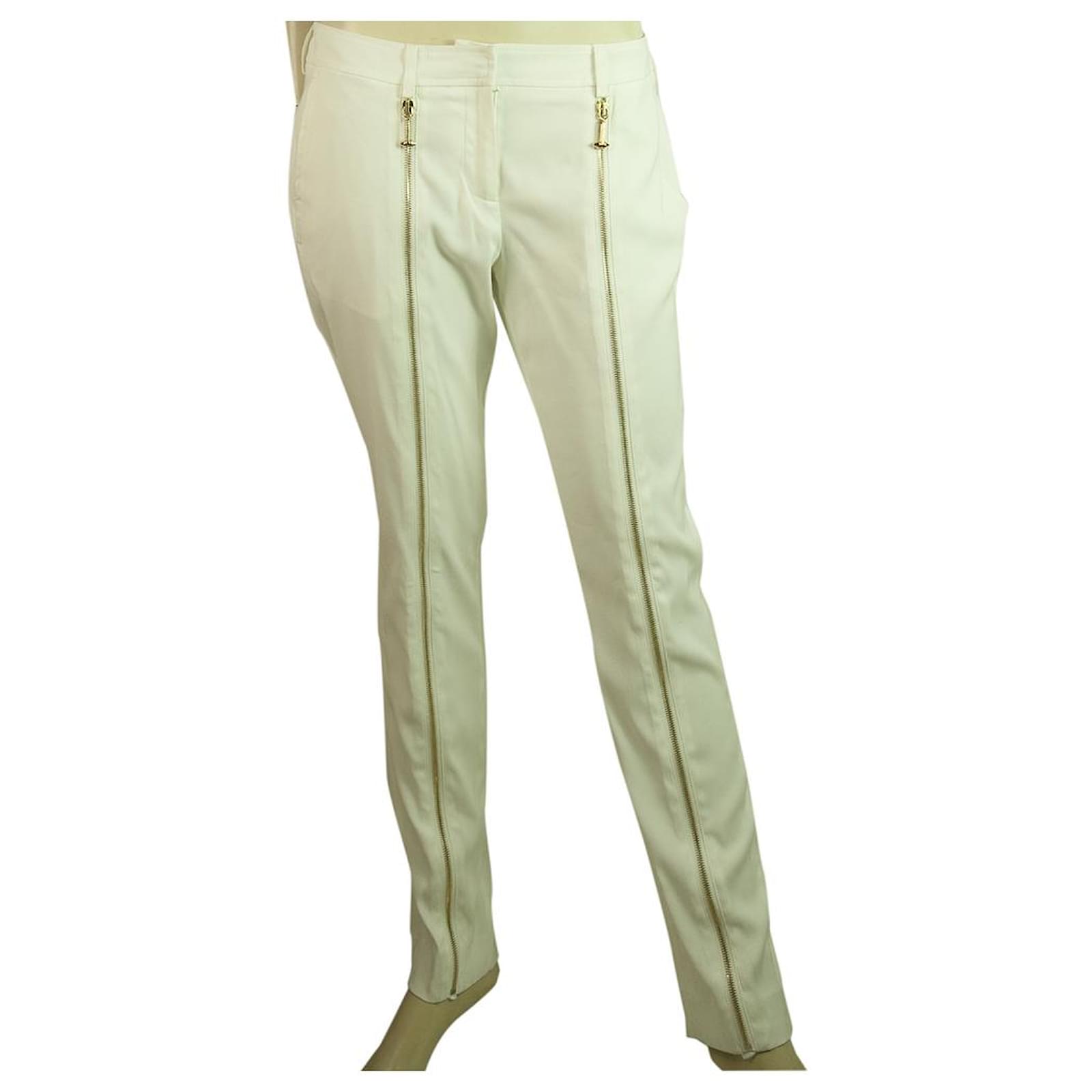 white jeans with gold zippers