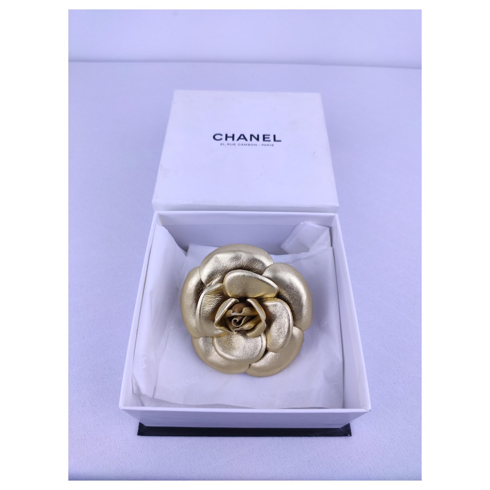 chanel leather brooch
