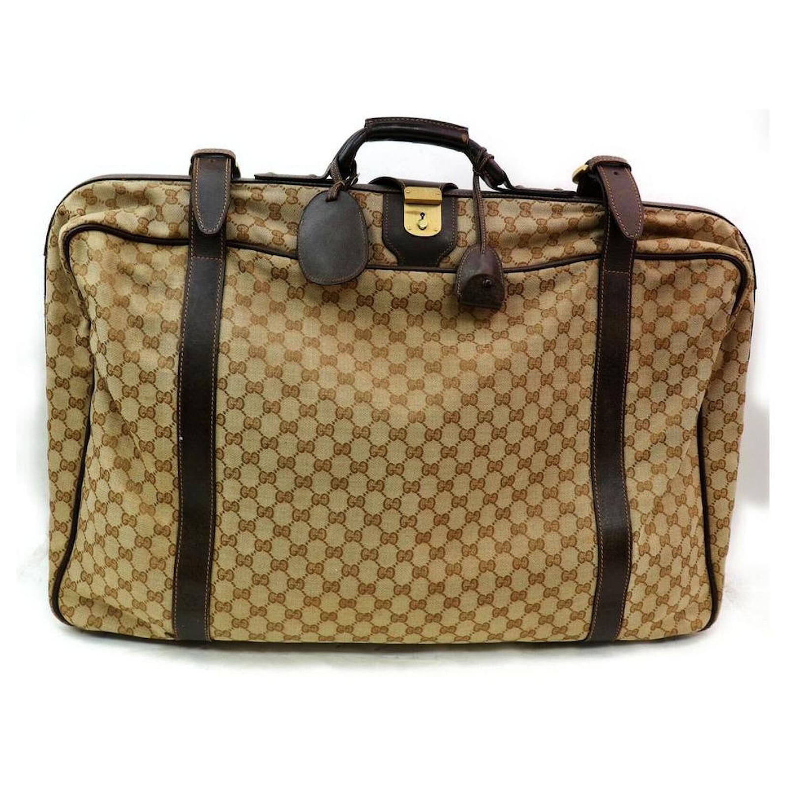 Gucci Tronco morbido per valigia con monogramma GG Marrone Pelle Metallo  ref.291835 - Joli Closet