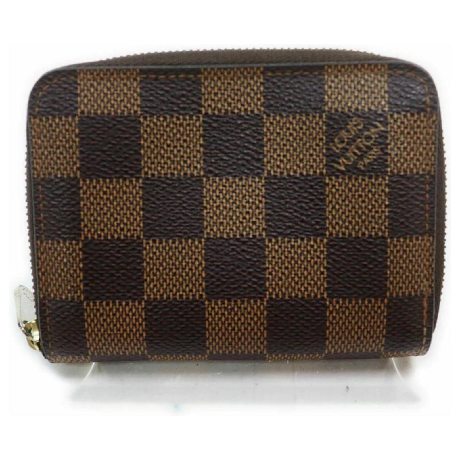 Louis Vuitton Portafoglio compatto con cerniera Damier Ebene Zippy Coin  Purse Metallo ref.294274 - Joli Closet