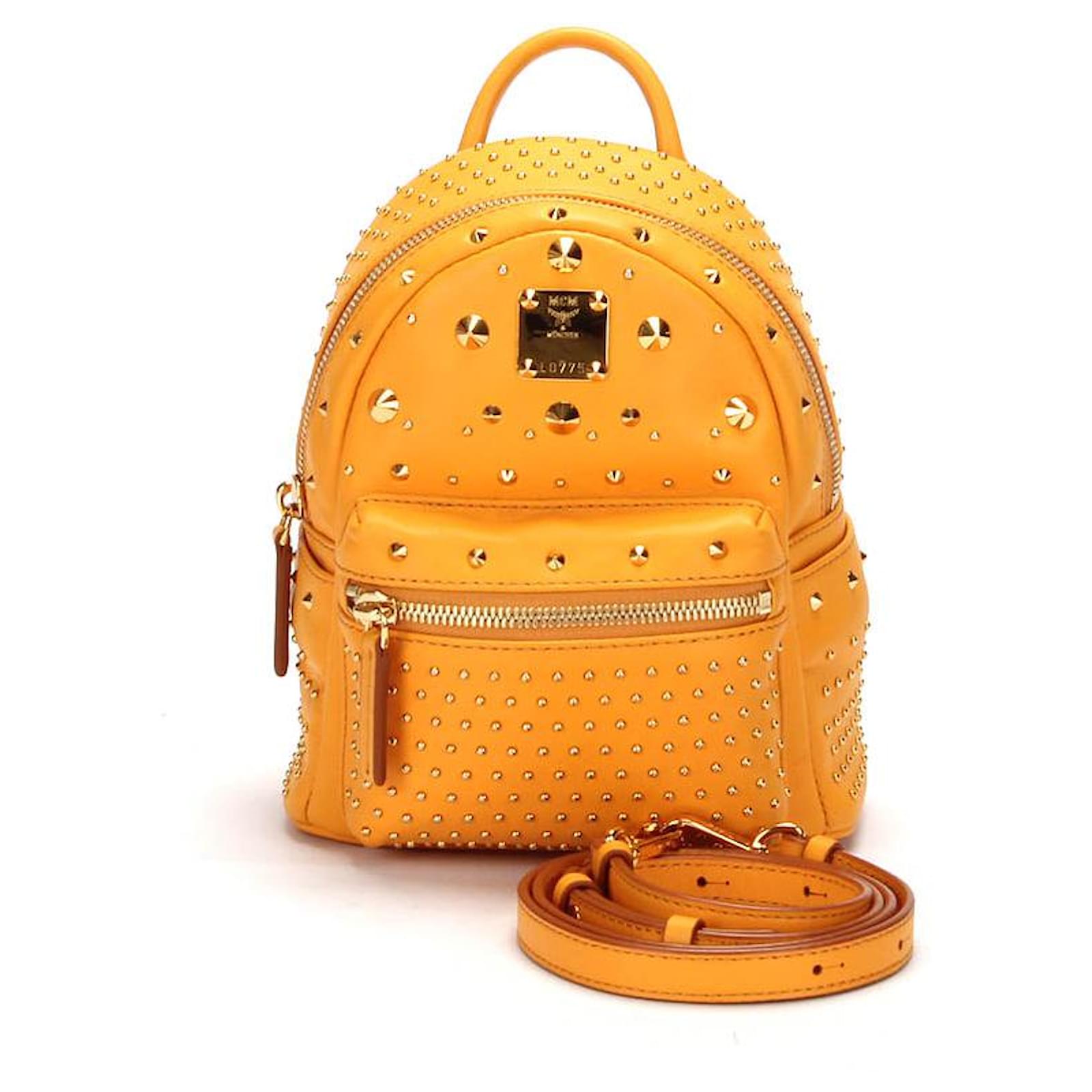 Mcm yellow outlet backpack