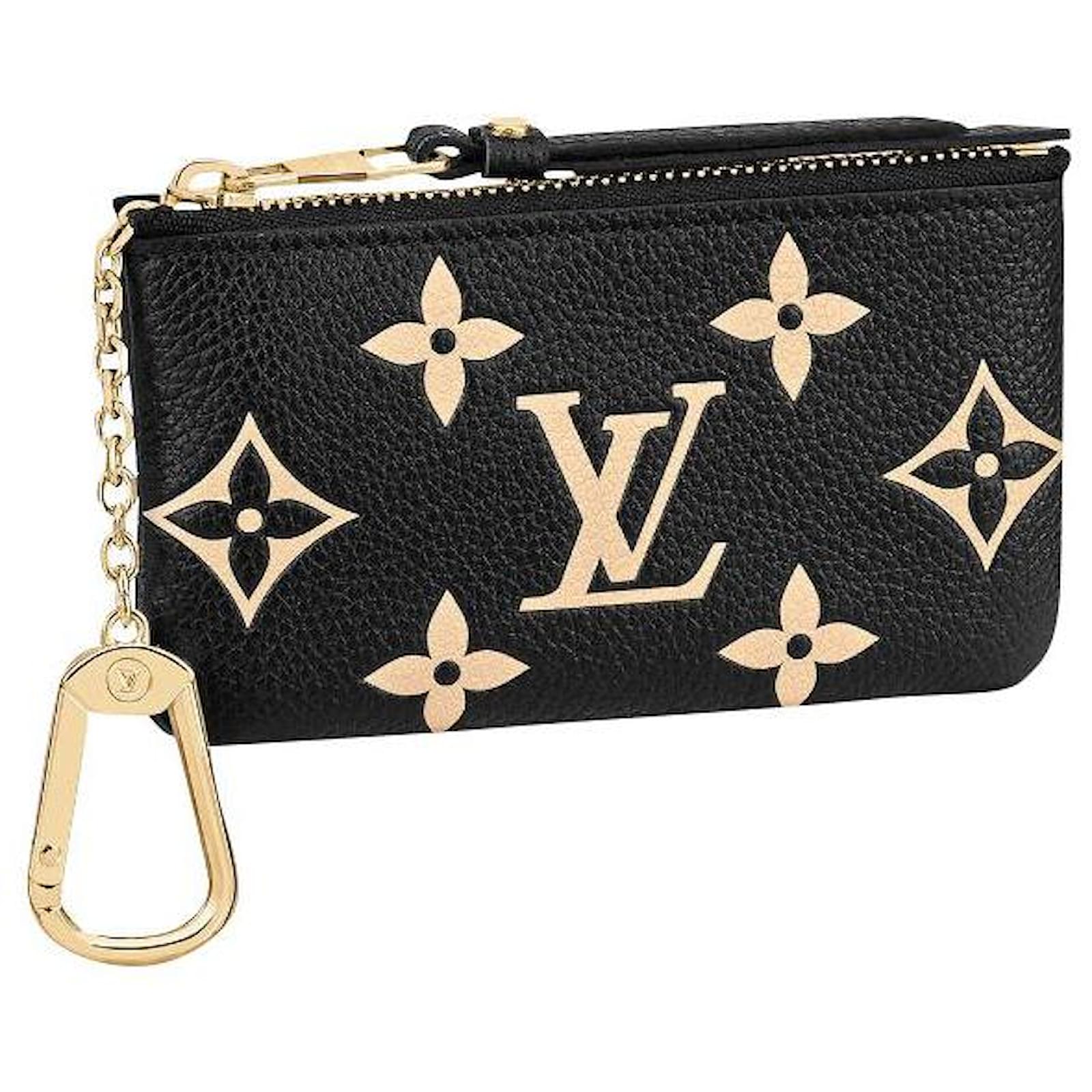 black and gold lv purse
