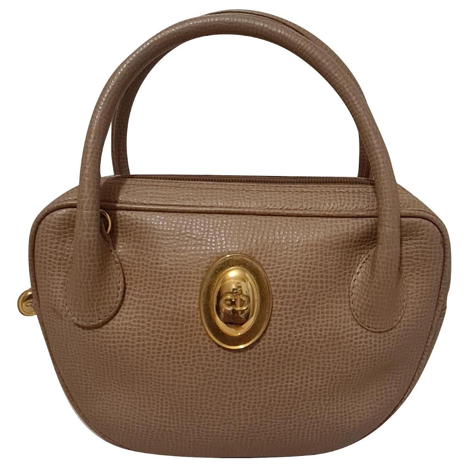 Dior Saddle bag in brown and beige suede and sheepskin Leather
