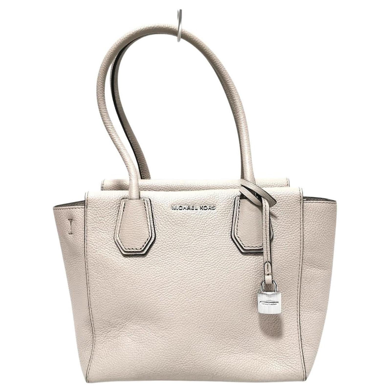 cream color michael kors purse