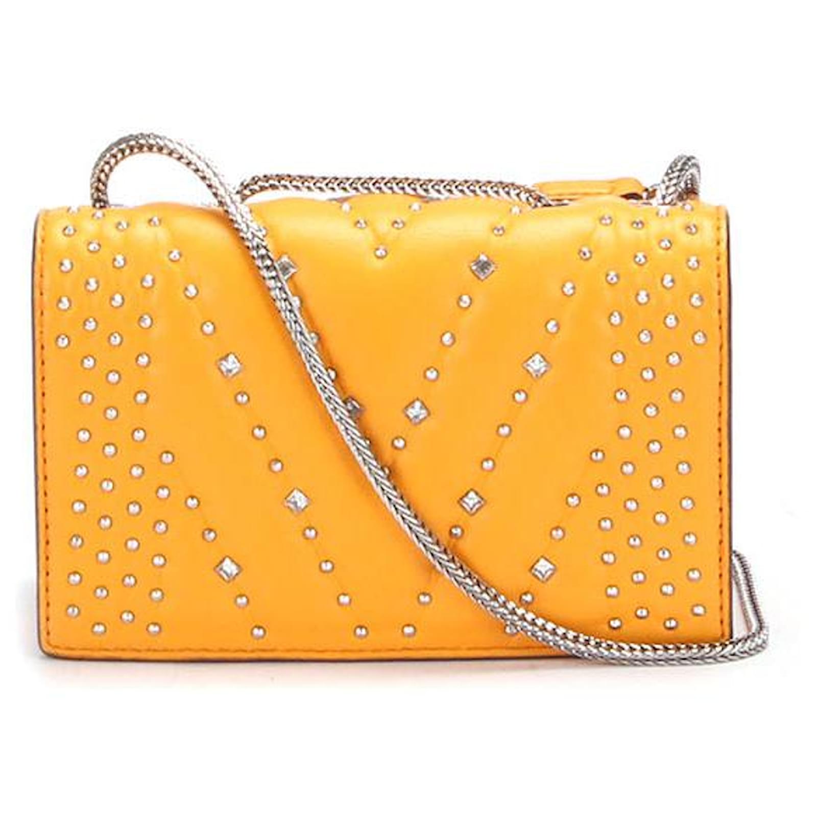 yellow mcm purse