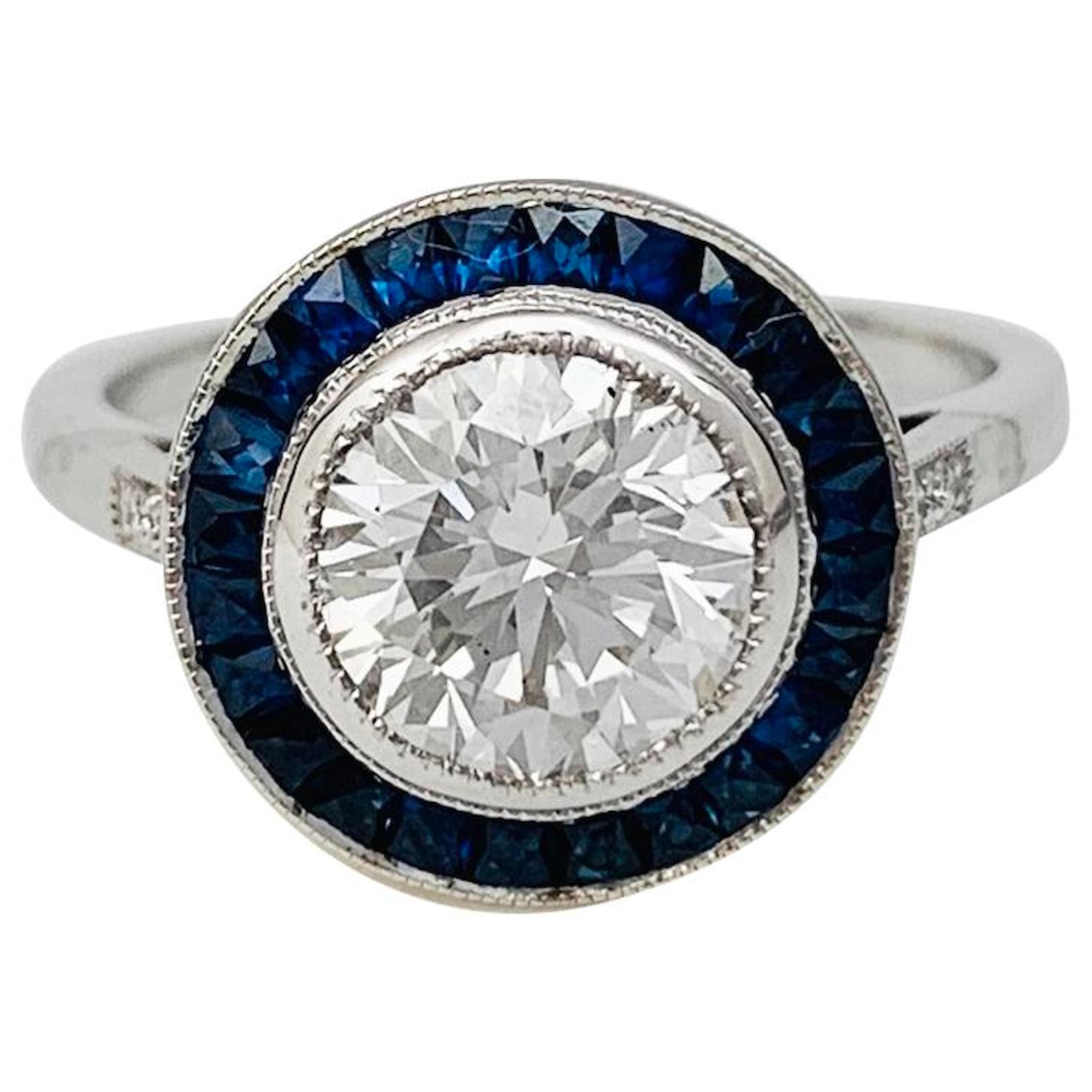 diamond surrounded by sapphires ring