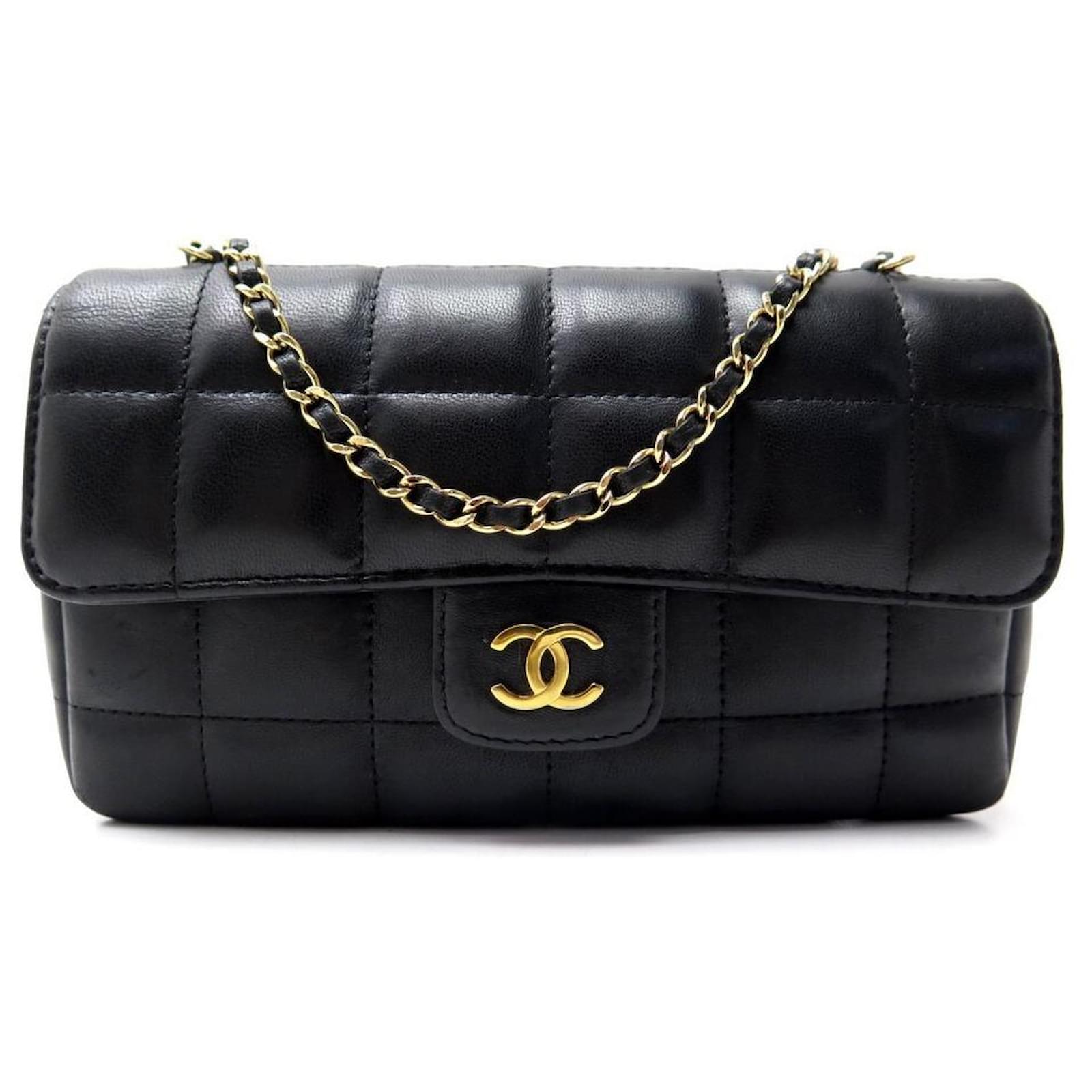 CHANEL CAMELIA MINI HANDBAG IN BLACK QUILTED LEATHER BANDOULIERE