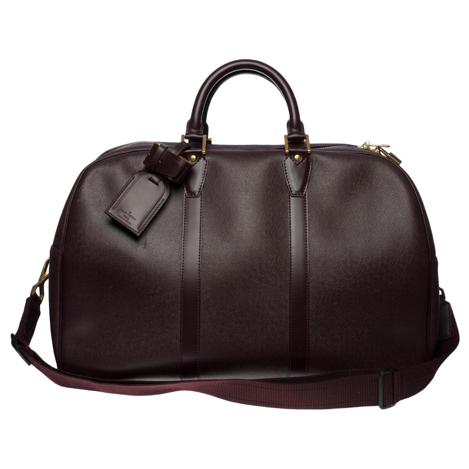 Very beautiful Louis Vuitton Kendall travel bag in burgundy
