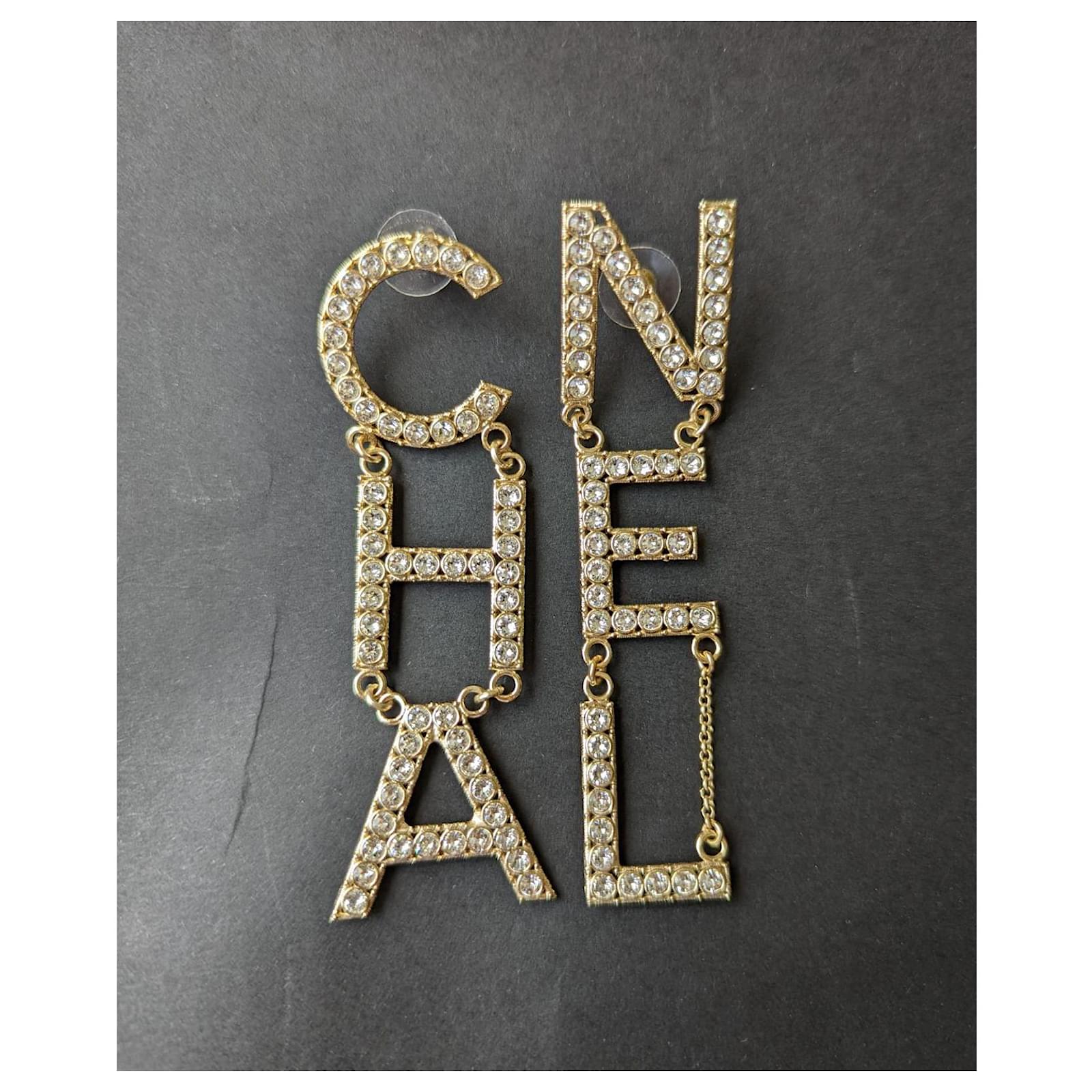 chanel golden metal cha nel b19s ghw crystal letter dangling earrings