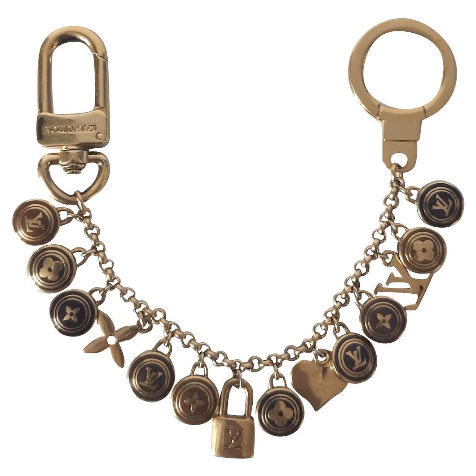 Louis Vuitton Gold Porte Cles Swing Tassel Bag Charm Golden Metal  ref.356503 - Joli Closet