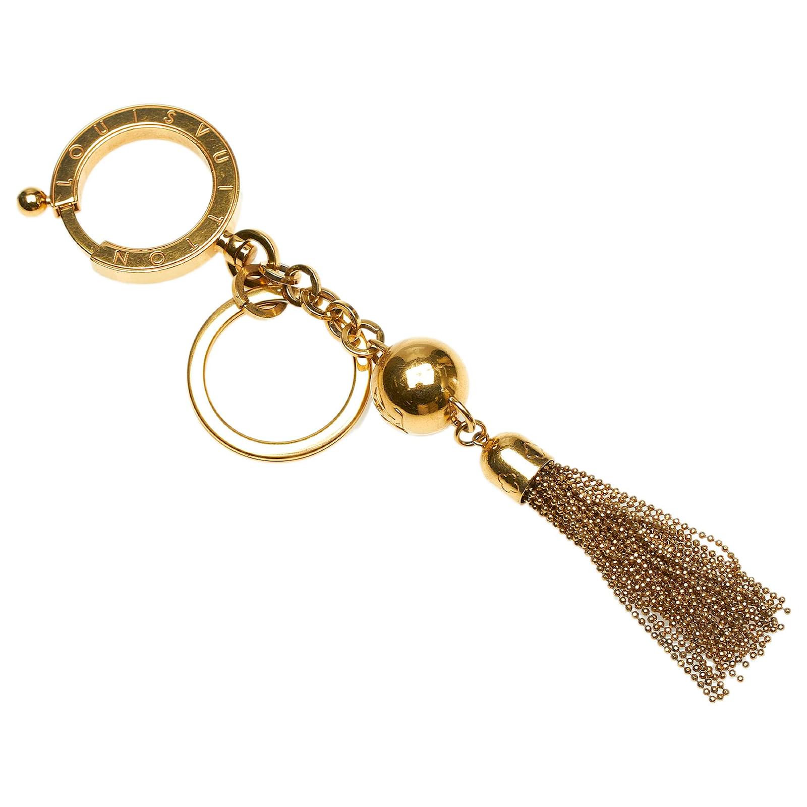 Louis Vuitton Gold Porte Cles Swing Tassel Bag Charm Golden Metal  ref.514904 - Joli Closet