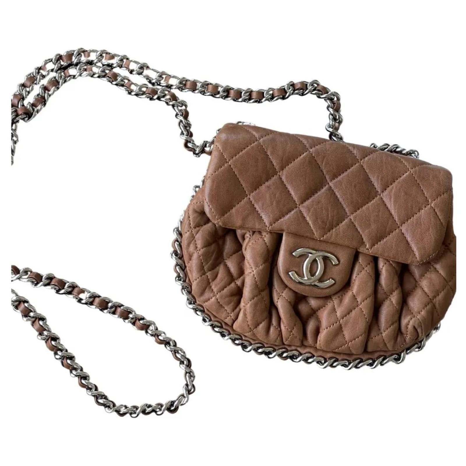 Chanel Chain Around Bag Mini Size In dark beige or camel color.