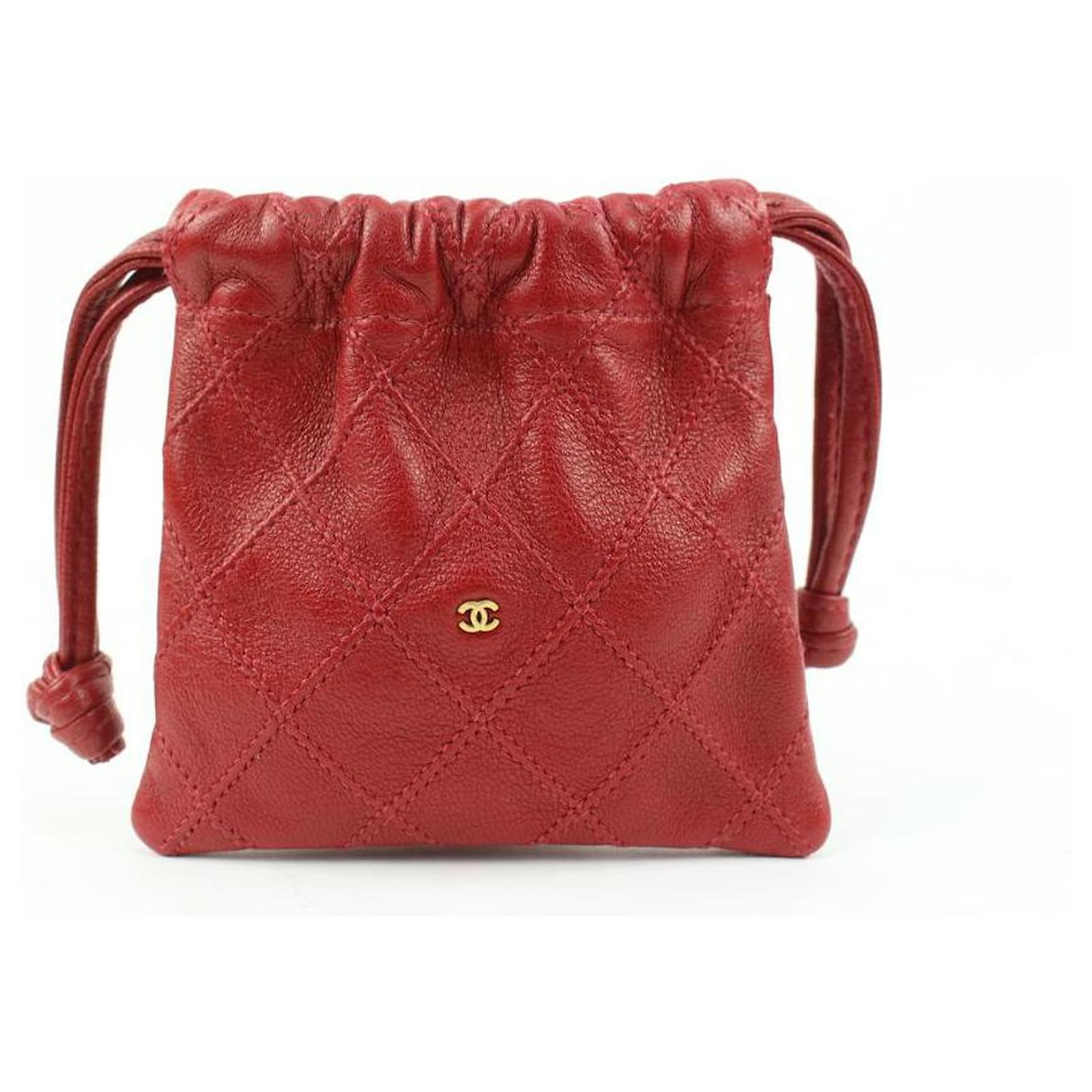 Chanel Red Quilted Lambskin Mini Drawstring Pouch Leather ref.538612 - Joli  Closet